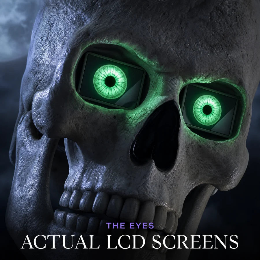 Close up of the skull, both eye sockets holding lit LCD screens with a green iris