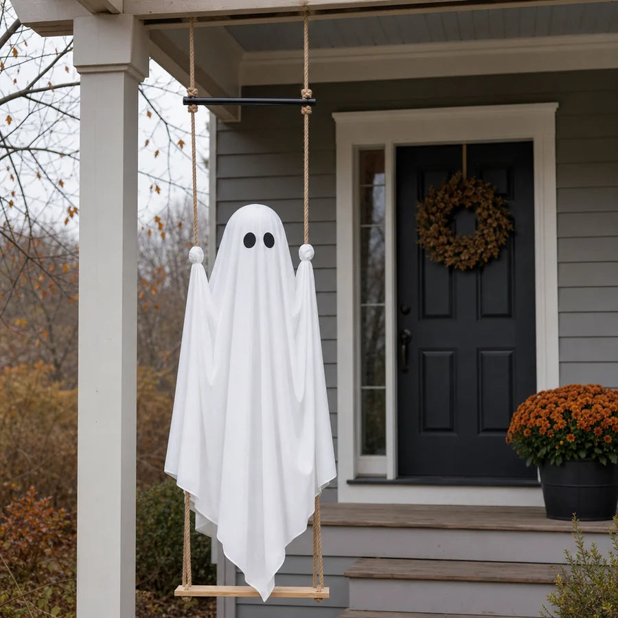 The swing ghost hanging from a front porch beam at dusk