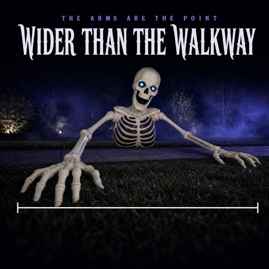 Low night shot along the arms, both bony hands reaching past the edges of the walkway behind