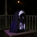 Sister Shadow Mask on a porch at night